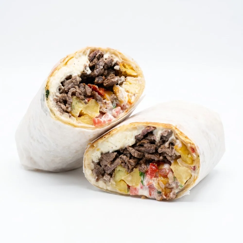 Burrito California cut in half, steak and fries inside